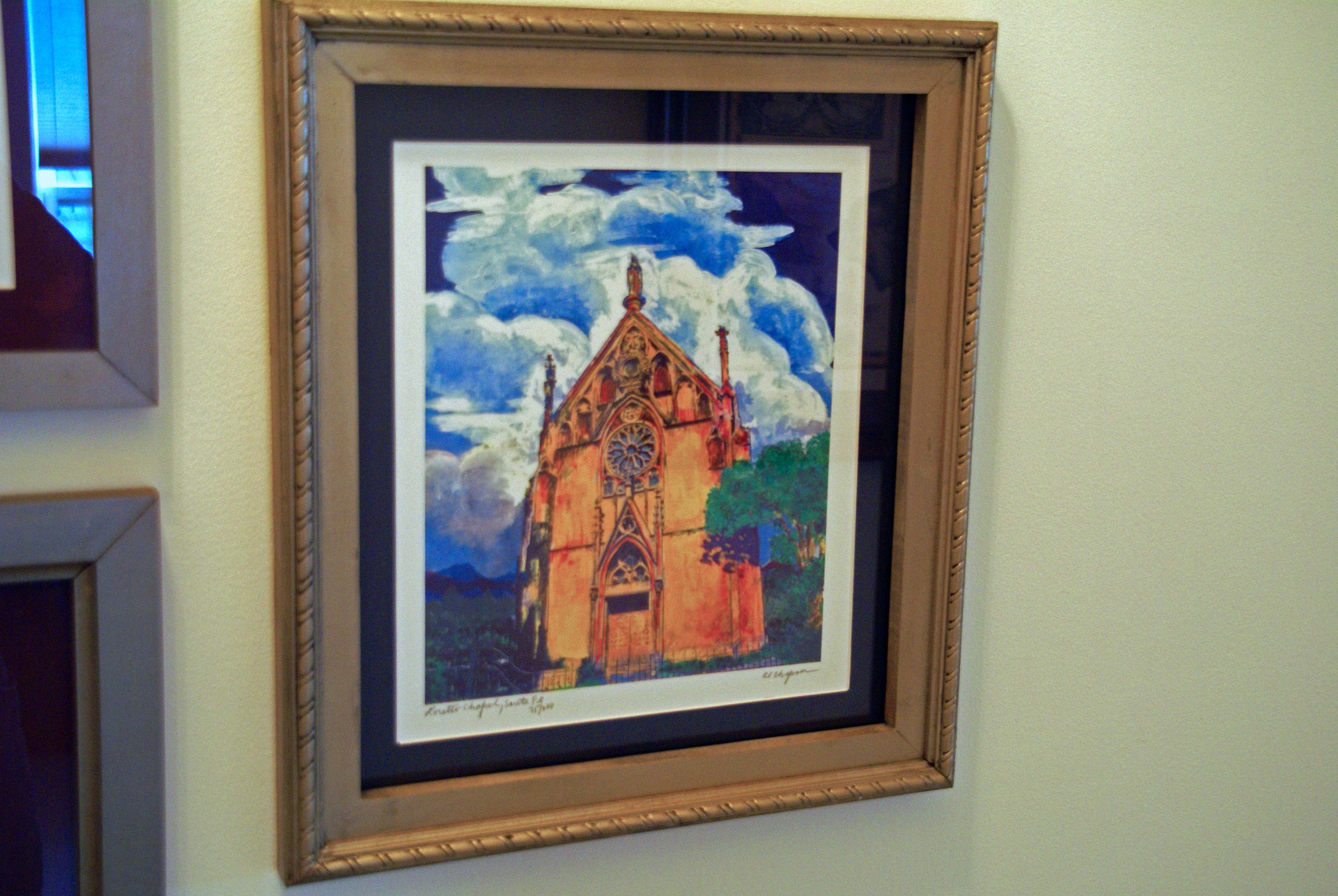 water color photo with gold frame and dark blue mat